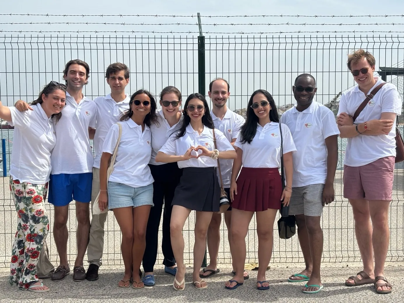 Members of Societas Lucae together in Portugal, one forming a heart with her hands